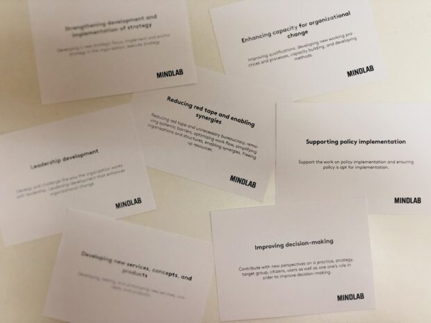 A picture of some cards, produced by 'Mindlab' which ask questions about how we evaluate ourselves