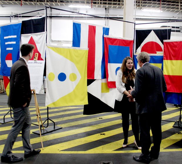 This is an image of policy makers and industry stakeholders discussing the speculative flag installation at London International Shipping Week 2019.