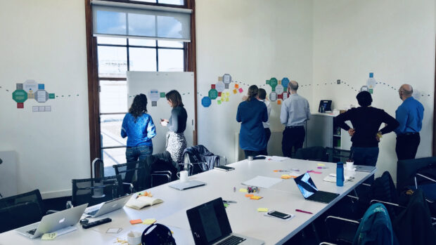 This is an image of the workshop we ran with analysts from a range of departments to share our research insights using a kinaesthetic mapping approach.