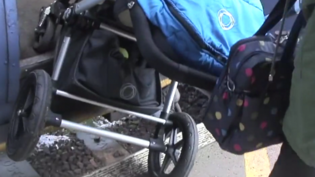This is a screenshot from Policy Lab's film ethnography for the Department for Transport's future of rail project, showing someone boarding a train with a pushchair.